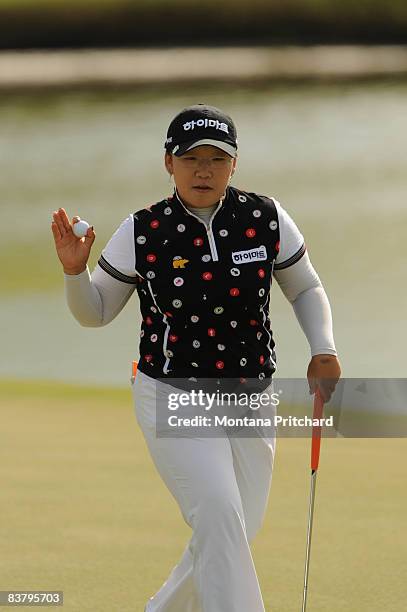 Ji-Yai Shin of South Korea waves to the gallery after a birdie putt on the 16th hole during the final round of the ADT Championship at the Trump...