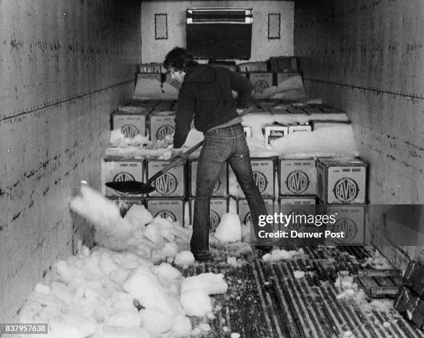 John Parka shovels the ice formed in a refrigerated truck at the Famularo warehouse, Produce is moved from the truck after arrival to the 28 coolers...