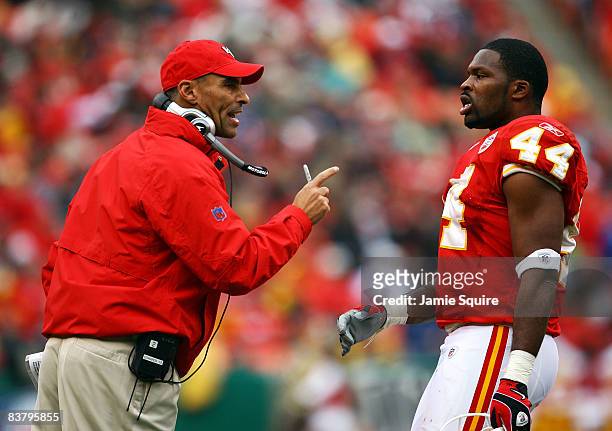 Head coach Herm Edwards of the Kansas City Chiefs speaks with Jarrad Page the sidelines during the game against the Buffalo Bills on November 23,...