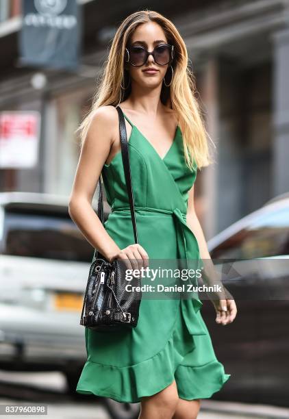 Rosa Crespo is seen in Soho wearing an Iorane green dress on August 22, 2017 in New York City.