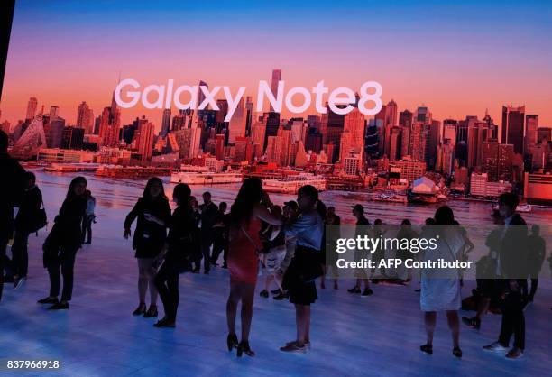 Members of the media get a look at the Samsung Galaxy Note 8 after it was unveiled at the Samsung Galaxy Unpacked 2017 event on August 23, 2017 in...