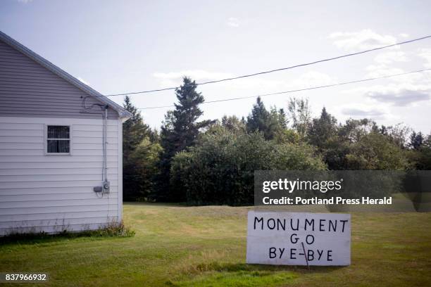 An anti-monument sign in Mike Guiggey's yard on Route 11 near the Katahdin Woods and Waters National Monument.