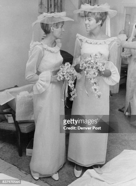 Bridegroom's Sisters are Bride's Attendants Awaiting their cue to lead bridal procession are Mrs. James Eldridge, left, and Mrs. Anson Garnsey,...
