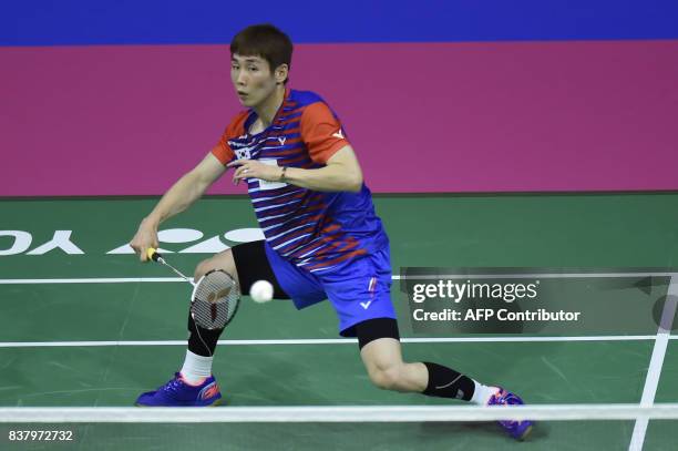 Korea's Wan Ho Son returns to Hungary's Gergely Krausz during their round two mens's singles match during the 2017 BWF World Championships of...