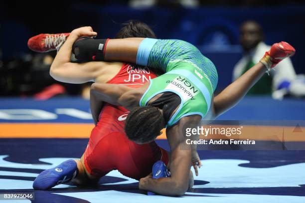 Haruna Okuno of Japan and Odunayo Folasade Adekuoroye of Nigeria during the female 55 kg wrestling competition of the Paris 2017 Women's World...