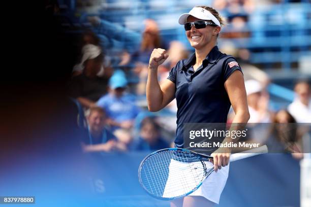 Kirsten Flipkens of Belgium celebrates after defeating Ana Bogdan of Romania during Day 6 of the Connecticut Open at Connecticut Tennis Center at...