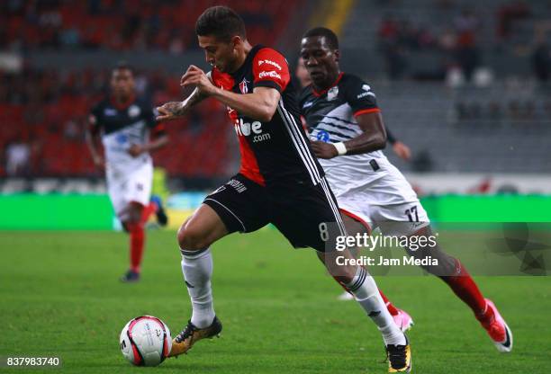 Uvaldo Luna of Atlas and Luis Advincula of Lobos BUAP fight for the ball during the 6th round match between Atlas and Lobos BUAP as part of the...