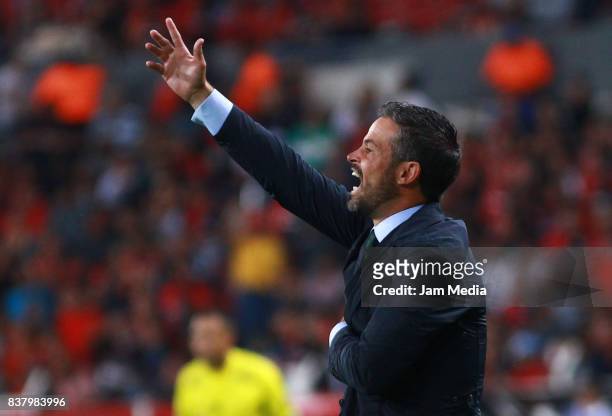 Rafael Puente, Coach of Lobos BUAP gives instructions to his players during the 6th round match between Atlas and Lobos BUAP as part of the Torneo...