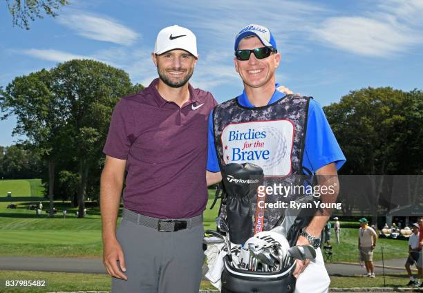 Kyle Stanley poses with his Military Caddie during practice for THE NORTHERN TRUST at Glen Oaks Club on August 23 in Old Westbury, New York.