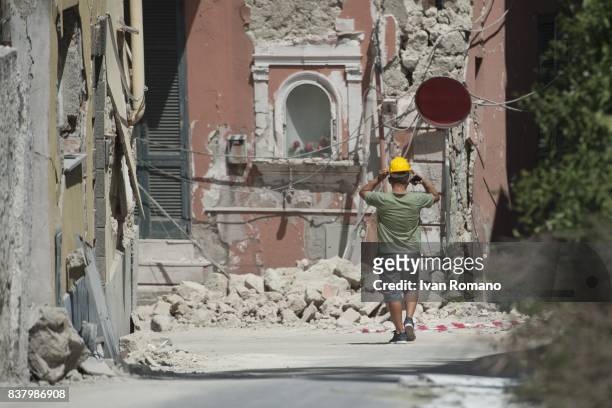 Citizen leaves the red zone affected by the earthquake on August 23, 2017 in Casamicciola Terme, Italy. A magnitude-4.0 earthquake struck the Italian...