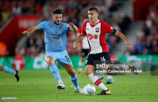 Ben Marshall of Wolverhampton Wanderers and Oriol Romeu of Southampton during the Carabao Cup Second Round match between Southampton and...