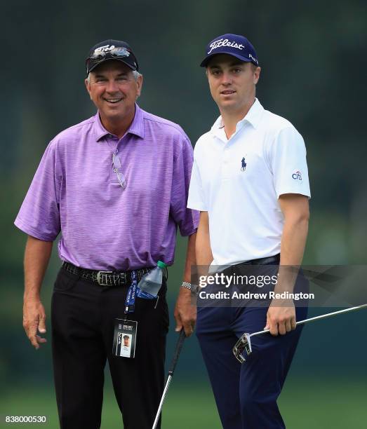 Justin Thomas of the USA is pictured with his father Mike Thomas during practice for The Northern Trust at Glen Oaks Club on August 23, 2017 in...