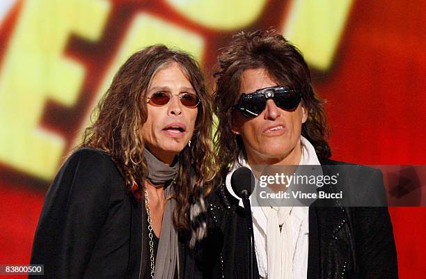 Musicians Steven Tyler and Joe Perry present the Artist of the Year award onstage during the 2008 American Music Awards held at Nokia Theatre L.A....