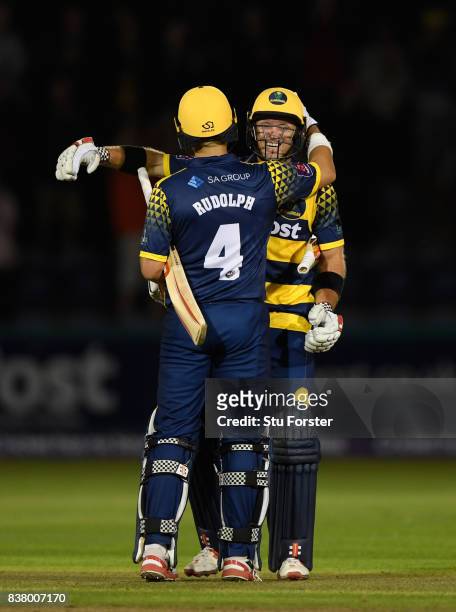 Glamorgan batsmen Jacques Rudolph and Colin Ingram celebrate victory after the NatWest T20 Blast Quarter-Final match between Glamorgan and...