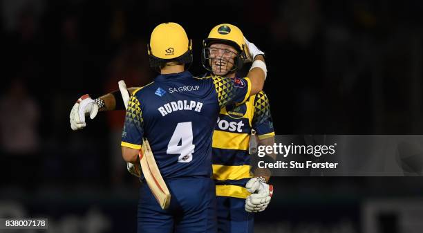 Glamorgan batsmen Jacques Rudolph and Colin Ingram celebrate victory after the NatWest T20 Blast Quarter-Final match between Glamorgan and...