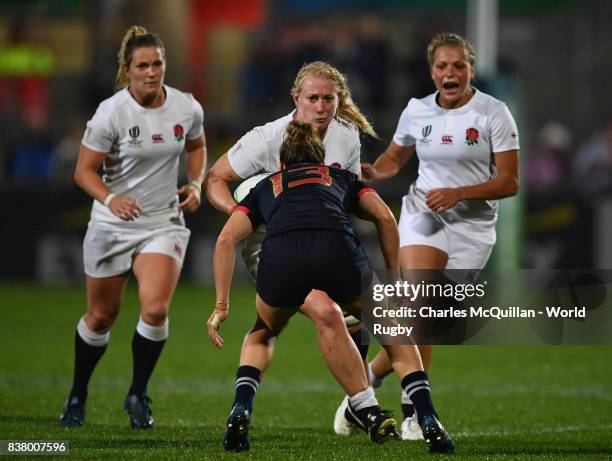 Tamara Taylor of England runs at Caroline Ladagnous of France during the Womens Rugby World Cup semi-final between England and France at the Kingspan...