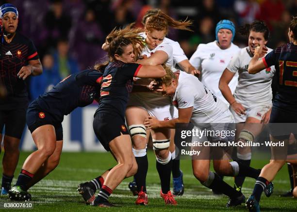 Harriet Millar-Mills of England charges through the France defence during the Womens Rugby World Cup semi-final between England and France at the...