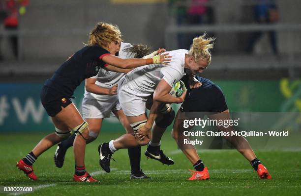 Tamara Taylor of England is tackled during the Womens Rugby World Cup semi-final between England and France at the Kingspan Stadium on August 22,...