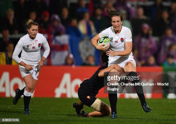 Emily Scarratt of England and Caroline Drouin of France during the Womens Rugby World Cup semi-final between England and France at the Kingspan...