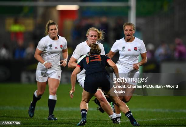 Tamara Taylor of England runs at Caroline Ladagnous of France during the Womens Rugby World Cup semi-final between England and France at the Kingspan...