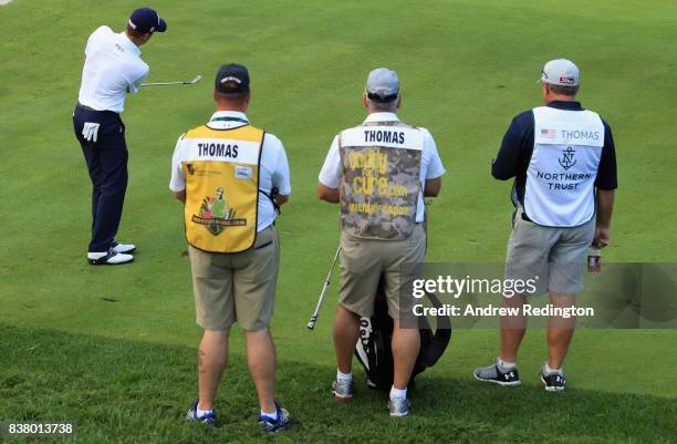 Justin Thomas of the USA is pictured with three caddes during practice for The Northern Trust at Glen Oaks Club on August 23, 2017 in Westbury, New...