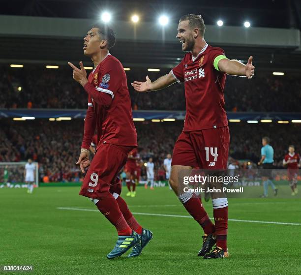 Roberto Firmino of Liverpool celebrates the forth goal during the UEFA Champions League Qualifying Play-Offs round second leg match between Liverpool...