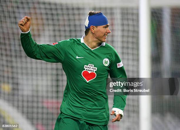 Edin Dzeko of VfL Wolfsburg celebrates the fifth goal during the Bundesliga match between VfL Wolfsburg and VfB Stuttgart at the Volkswagen Arena on...