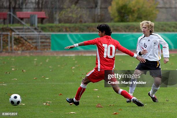 Ahmed Sassi of Tunisia shields the ball from David Karg Lara of Gemany during the Under 16 International Friendly match between Germany and Tunisia...