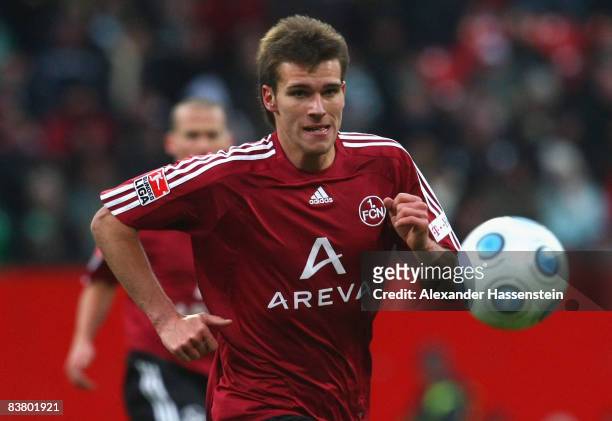 Christian Eigler of Nuernberg runs with the ball during the second Bundesliga match between 1. FC Nuernberg and SpVgg Greuther Fuerth at the...