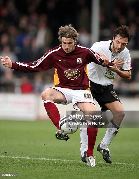 Ryan Gilligan of Northampton Town attempts to control the ball under pressure from Clint Easton of Hereford United during the Coca Cola League One...