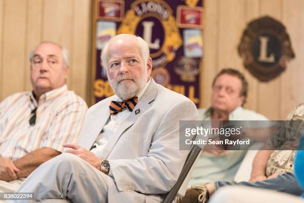 Charles Severance listens to U.S. Rep. Tom Rice during a congressional town hall meeting August 23, 2017 in Society Hill, South Carolina. Topics of...