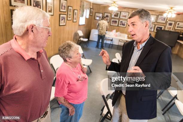 Rep. Tom Rice speaks with constituents after a congressional town hall meeting August 23, 2017 in Society Hill, South Carolina. Topics of concern for...