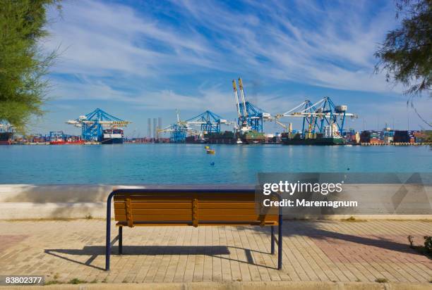a garden seat in front of malta freeport - zona industrial imagens e fotografias de stock