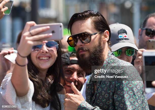 Jared Leto takes a selfie with a fan at "Extra" at Universal Studios Hollywood on August 23, 2017 in Universal City, California.