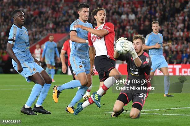 Will Norris of Wolverhampton Wanderers saves from Manolo Gabbiadini of Southampton during the Carabao Cup Second Round match between Southampton and...