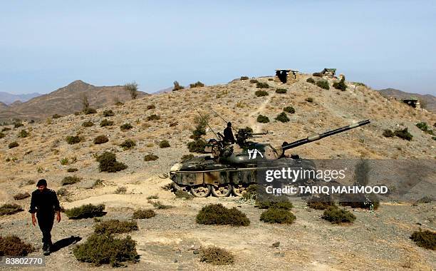 Pakistani troops take position on a mountain of Shina Ghundai area during ongoing operation in Muhmand agency, some 60kms from the north western city...