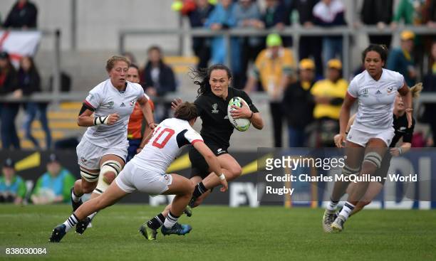 Portia Woodman of New Zealand breaks through the USA players to score a try during the Womens Rugby World Cup semi-final between New Zealand and USA...
