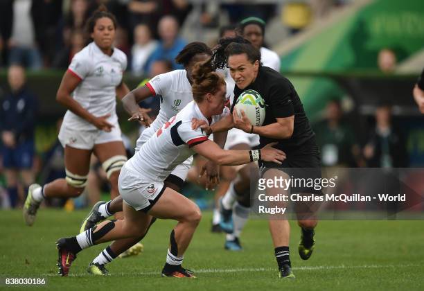Portia Woodman of New Zealand breaks through the USA players to score a try during the Womens Rugby World Cup semi-final between New Zealand and USA...