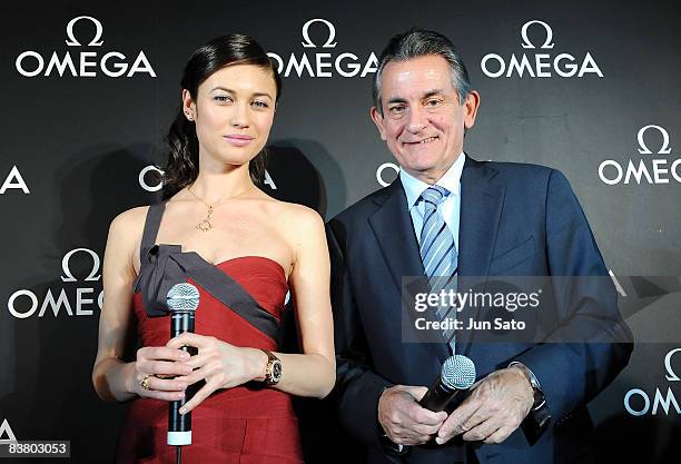 Actress Olga Kurylenko and President of Omega Stephen Urquhart attend the Omega - 007 Quantum Of Solace Party at Nicolas G. Hayek Center on November...