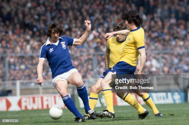 Ipswich Town striker Paul Mariner is challenged by Arsenal's Frank Stapleton and Malcolm MacDonald during the FA Cup Final at Wembley Stadium, 6th...