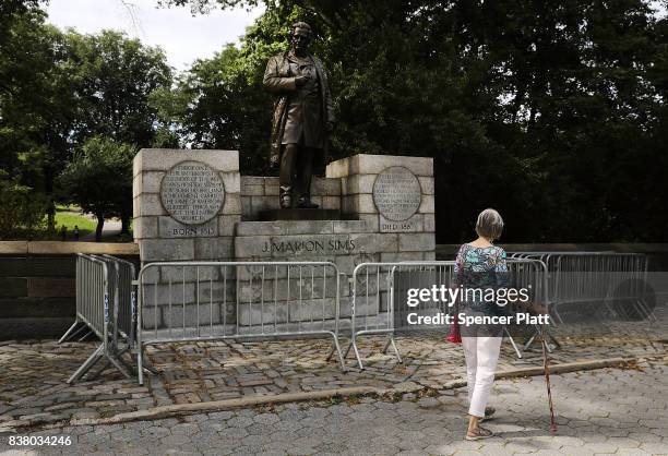 Statue of J. Marion Sims, a surgeon celebrated by many as the father of modern gynecology, stands along an upper Manhattan street on August 23, 2017...