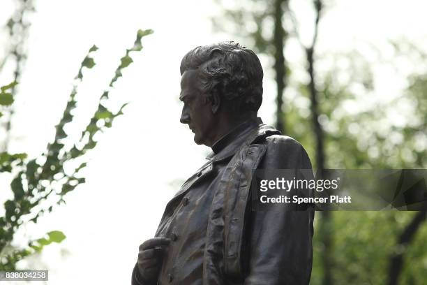 Statue of J. Marion Sims, a surgeon celebrated by many as the father of modern gynecology, stands along an upper Manhattan street on August 23, 2017...