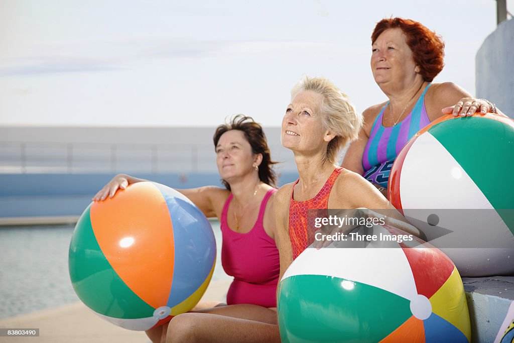Three women with beach balls 