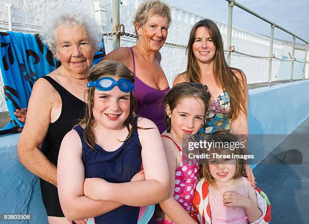 four generations of the same family by pool - 80s swimwear stock pictures, royalty-free photos & images