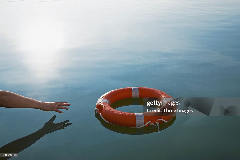 Someone reaching out for a life-ring