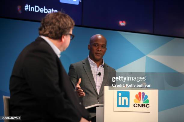 Jon Fortt, Co-Anchor of CNBC's Squawk Alley, moderates a debate between Reid Hoffman and Tim O'Reilly on August 23, 2017 at LinkedIn in San...