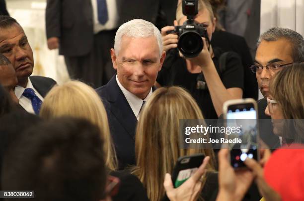 Vice President Mike Pence greets people after speaking about the ongoing crisis in Venezuela at Our Lady of Guadalupe Catholic Church on August 23,...