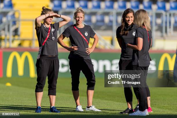 Tabea Kemme of Germany , Kathrin-Julia Hendrich of Germany and Goalkeeper Lisa Weiss of Germany looks on during the Group B match between Germany and...