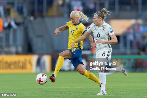 Caroline Seger of Sweden and Kristin Demann of Germany battle for the ball l during the Group B match between Germany and Sweden during the UEFA...