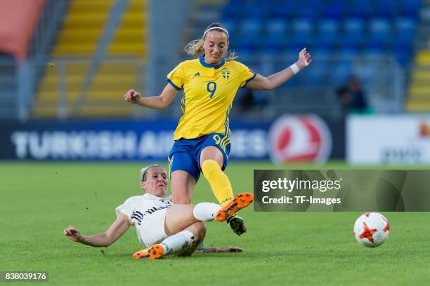 Anja Mittag of Germany and Kosovare Asllani of Sweden battle for the ball l during the Group B match between Germany and Sweden during the UEFA...